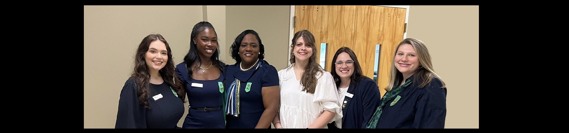  girl scout staff at annual meeting check-in table 